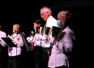 a group of people standing next to each other on a stage