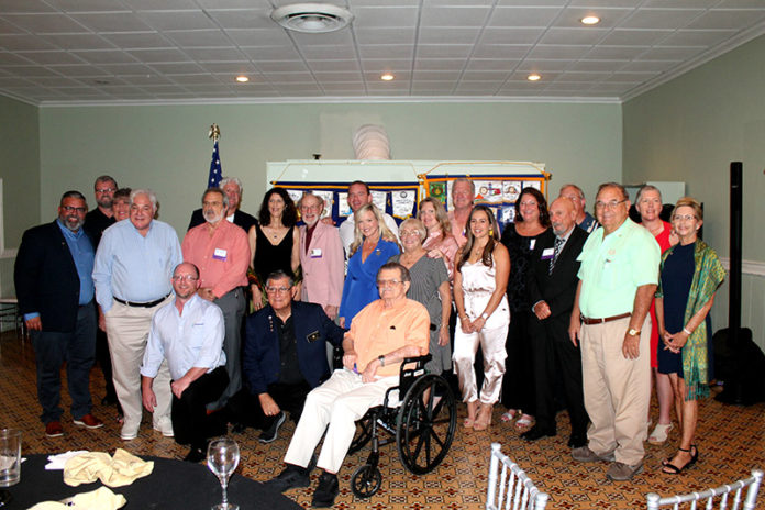 a group of people posing for a picture in a room