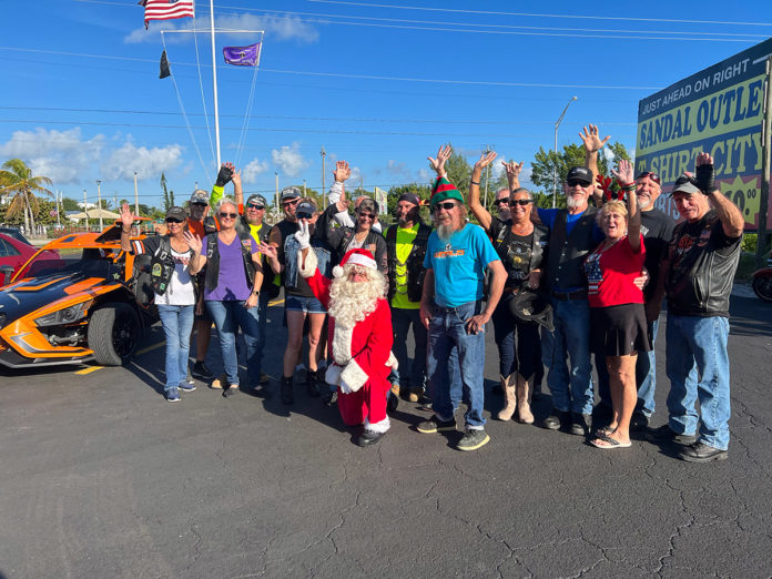 a group of people standing in a parking lot