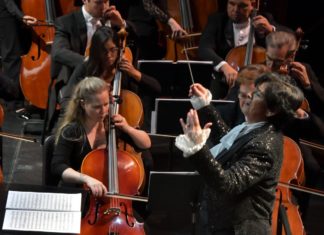 a group of people playing musical instruments on stage