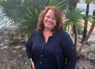 KEYS WEEKLY ADDS JILL MIRANDA BAKER TO ITS TALENTED TEAM a woman standing in front of a palm tree