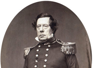 a black and white photo of a man in uniform