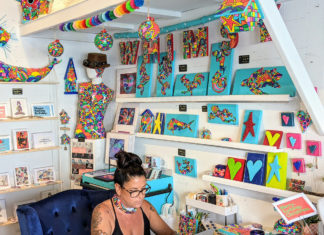 STOCK ISLAND ART STROLL HIGHLIGHTS DOZENS OF LOCAL CREATORS a woman sitting in a chair in a room