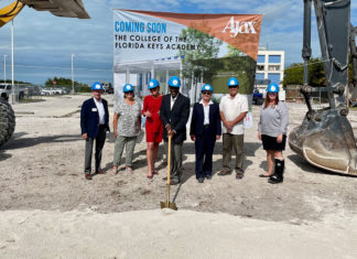 a group of people standing in front of a construction site