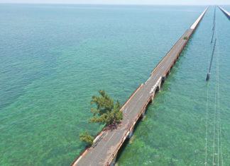 a long wooden bridge over a body of water