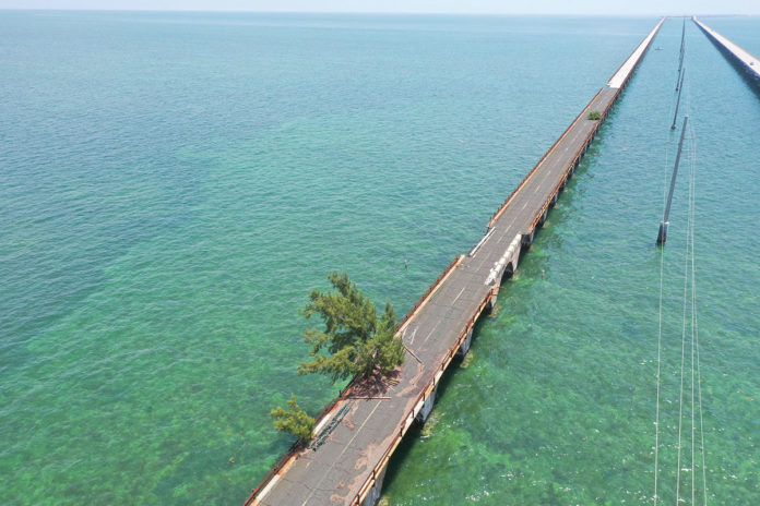 a long wooden bridge over a body of water