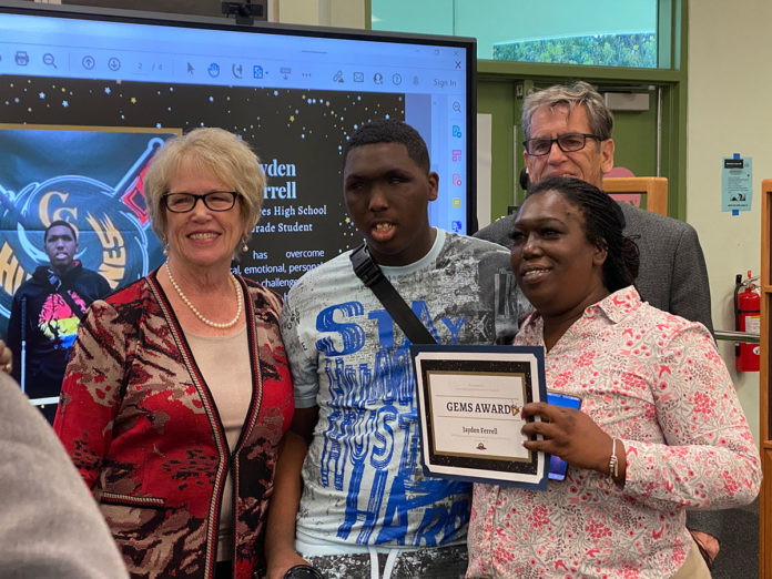 a group of people standing next to each other