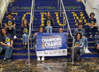 MHS CHAMPIONS FOR CHANGE TAKE ON D.C. a group of people sitting on the steps of a building