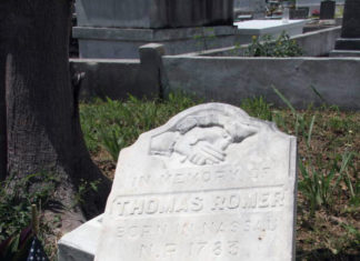 KEYS HISTORY: AFRICAN BAHAMIAN PRIVATEER & GROCER THOMAS ROMER LIVED TO BE 108 a grave with an american flag on it