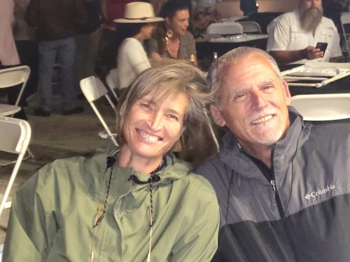 a man and a woman sitting next to each other