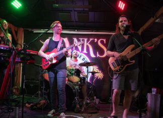 a group of people on stage playing instruments