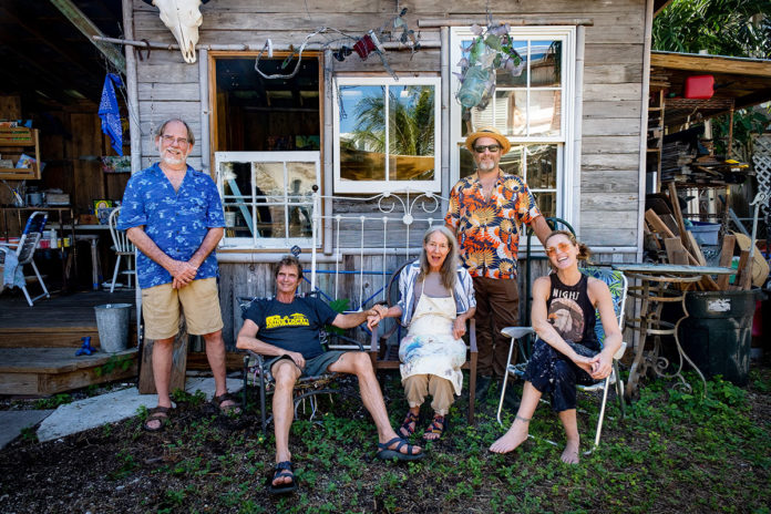 Studio-Tour-Dey-Street a group of people sitting outside of a house