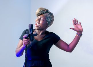 a woman standing in front of a microphone