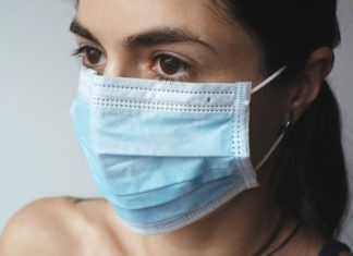 a woman wearing a surgical mask