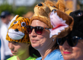 a group of people wearing animal hats