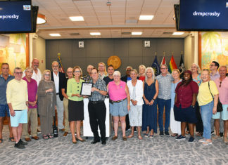 a group of people standing in a room