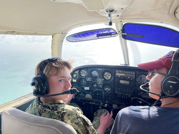 a couple of people that are sitting in a plane