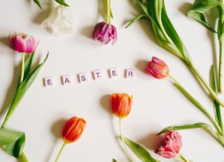 a white table topped with flowers and letters