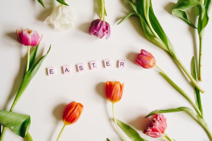 a white table topped with flowers and letters
