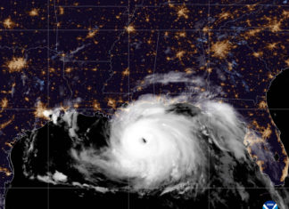 a satellite image of a hurricane in the night sky