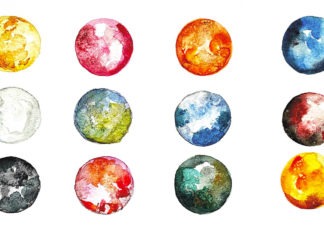 a bunch of different colored balls on a white background