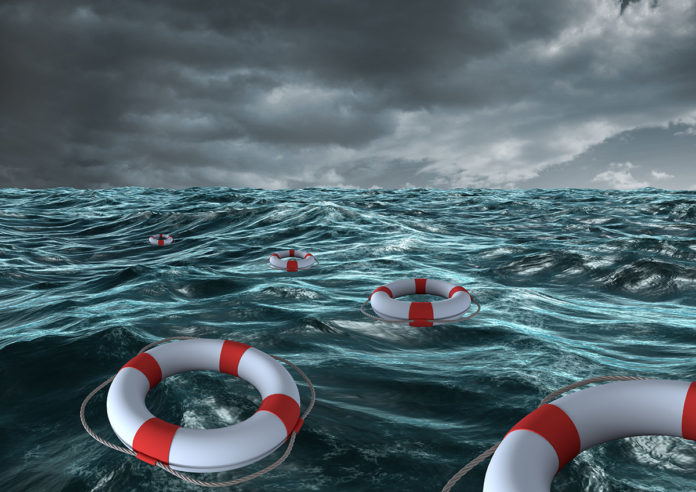 a group of life preservers floating on top of a body of water