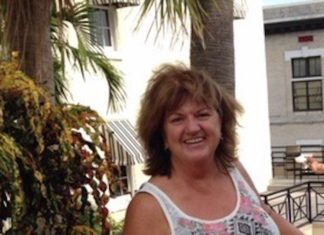 JOYFUL KEYS LIVING: FARM GIRL & EDUCATOR FROM CINCY GIVES BACK TO KEYS COMMUNITY a woman standing next to a palm tree