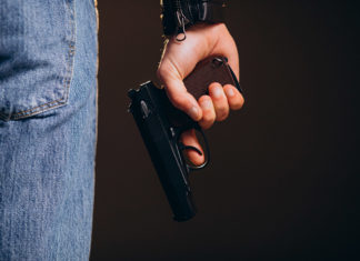 a person holding a gun in their hand
