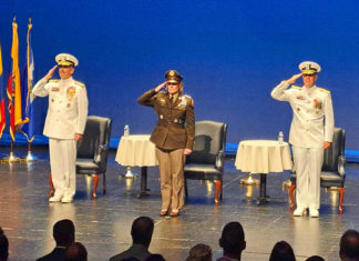 a group of people standing on top of a stage