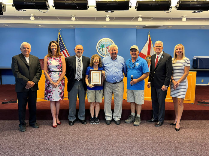 a group of people standing next to each other