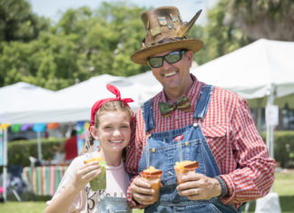 a man and a little girl standing next to each other