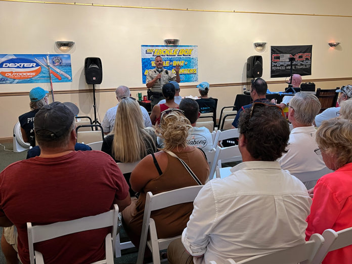 a group of people sitting in chairs in a room