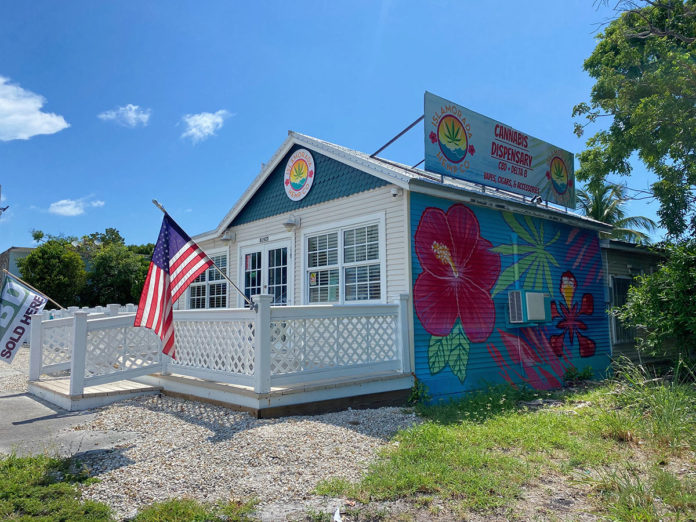 a small building with a flag on top of it