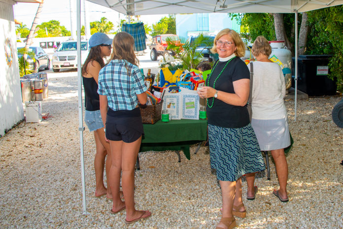a group of people standing under a tent