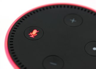 a close up of a red and black speaker
