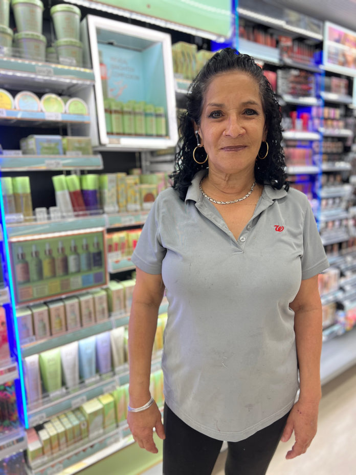 a woman standing in front of a store shelf