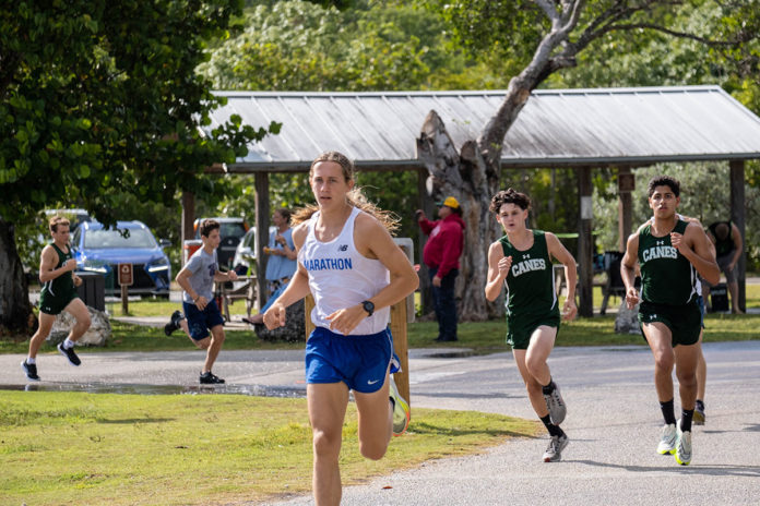 a group of people running down a road