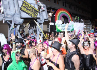 a large group of people in costumes at a parade
