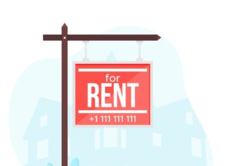 a red for rent sign hanging from a pole