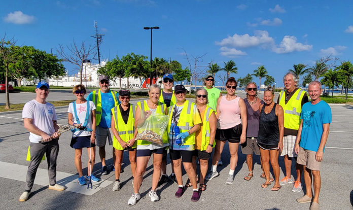a group of people standing in a parking lot