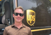 a man standing in front of a ups truck