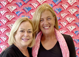 a couple of women standing next to each other
