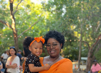 a woman holding a small child in her arms