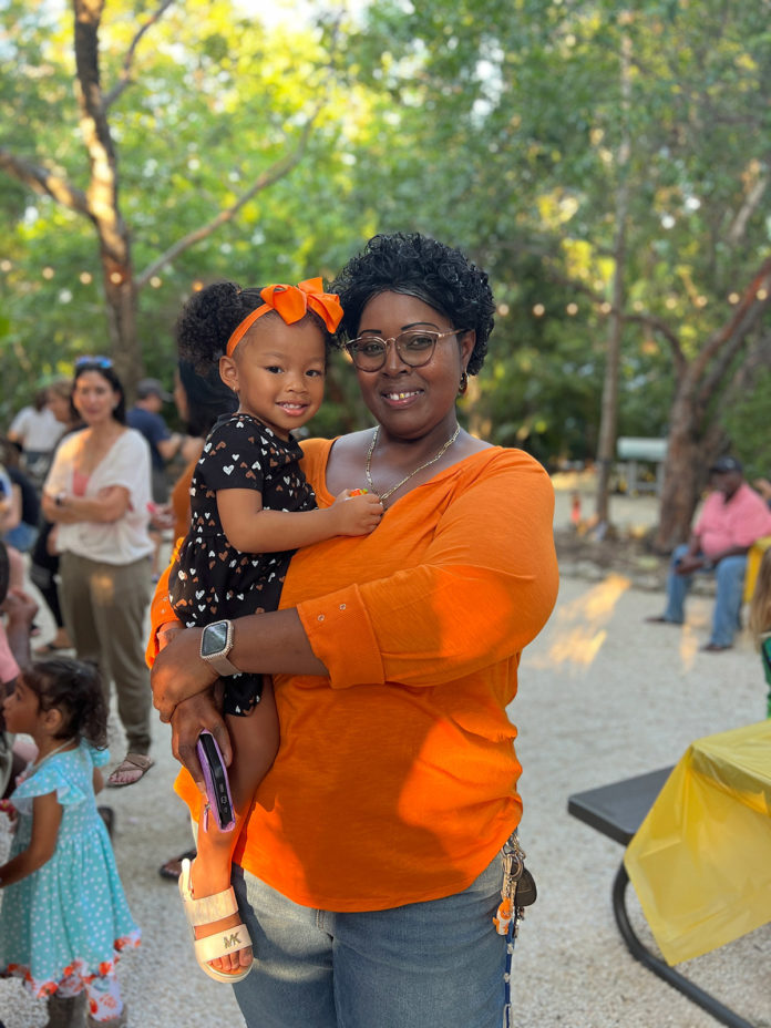 a woman holding a small child in her arms