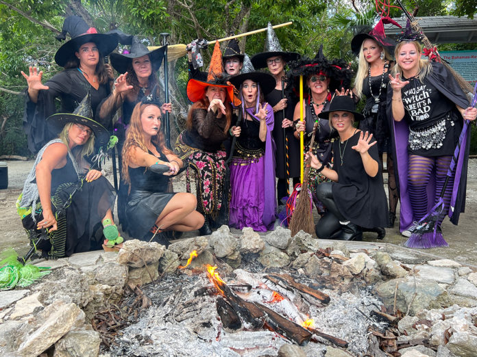 a group of people dressed up in witches costumes