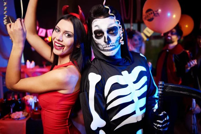 a couple of people that are dressed up in skeleton costumes