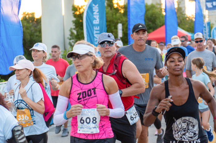 a group of people running in a marathon