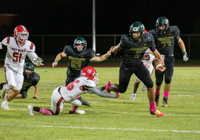 a group of people playing a game of football