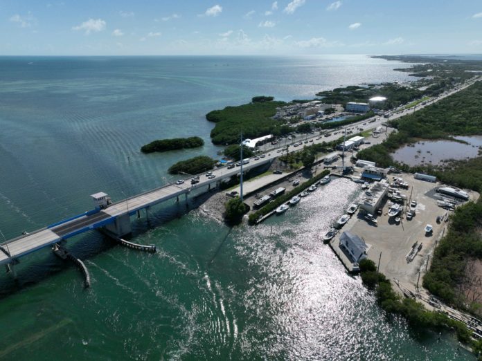 an aerial view of a bridge over a body of water