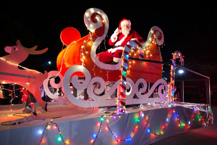 a float with a santa clause riding in a sleigh